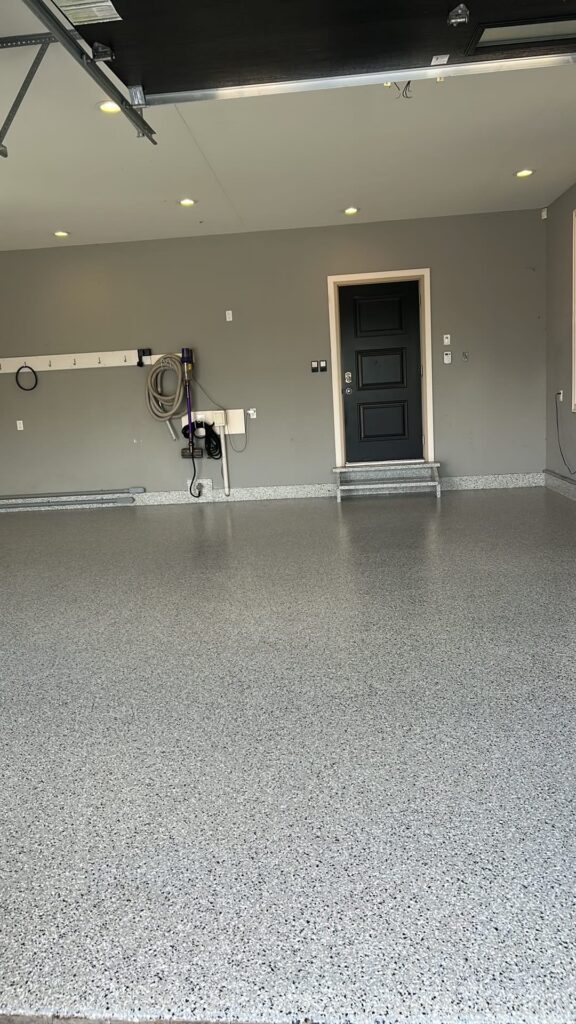 Cabin Fever flake polyurea garage floor with coved edges in Antigonish, Nova Scotia