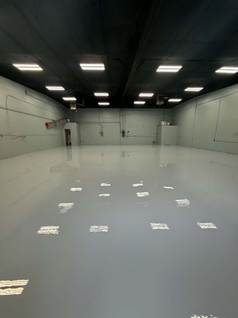 Finished 3,000 sq ft solid grey commercial epoxy floor with urethane topcoat in Burnside Industrial Park, Dartmouth NS