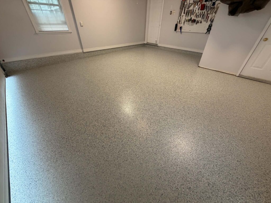 Close view of Tidal Wave flake texture on a polyurea garage floor in Dartmouth NS