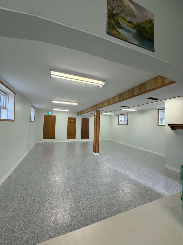 Church basement hall in Lochaber NS with a light Tidal Wave flake polyurea floor